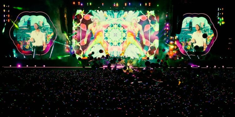 people standing in front of stage partying during nighttime