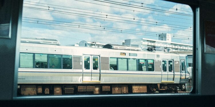 A train is viewed through a window.