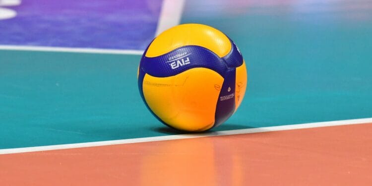 a yellow and blue ball on a pool table