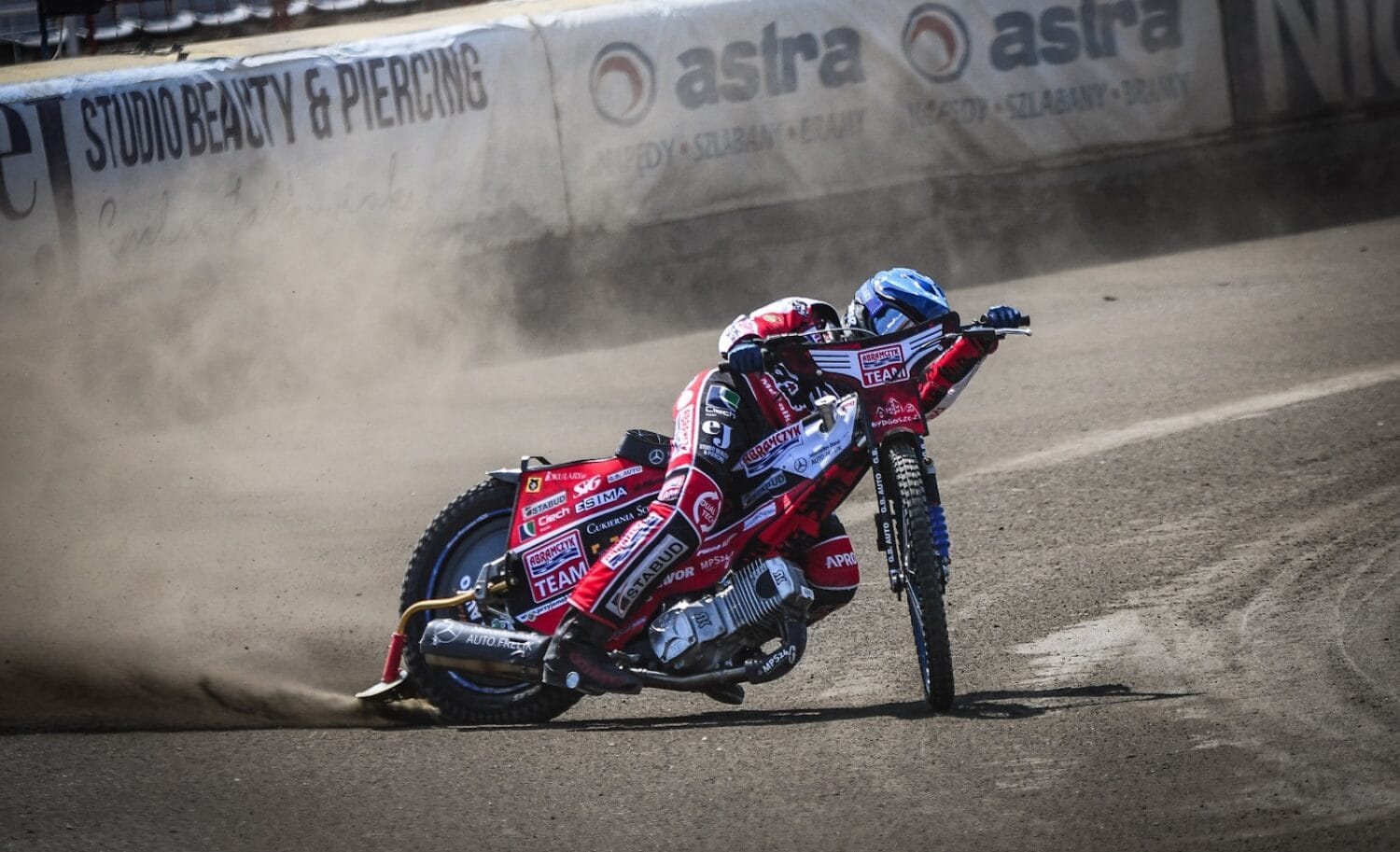 a man riding a motorcycle on top of a race track