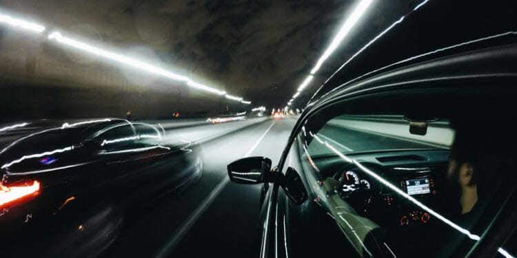 close-up photo of black car inside tunnel