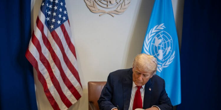 President Donald Trump signs the guest book at a bilateral meeting with U.N. Secretary General