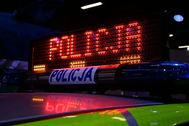 a close up of a police car sign