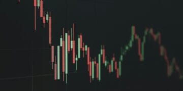 Stock market chart shows a declining trend.