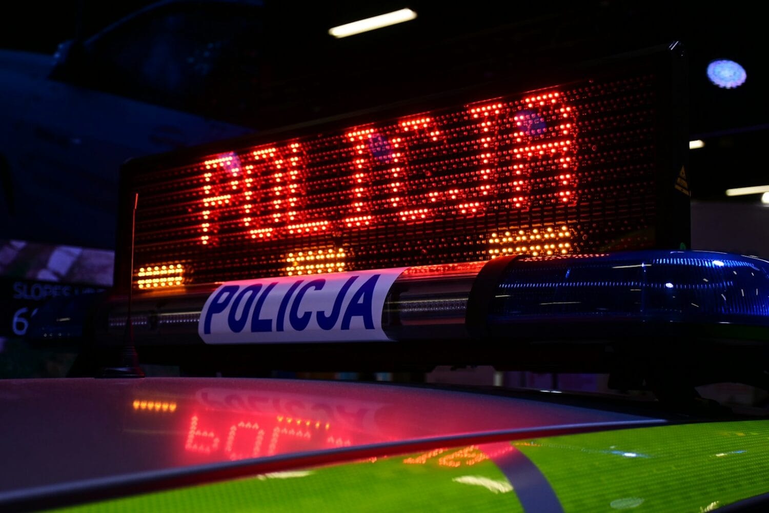 a close up of a police car sign